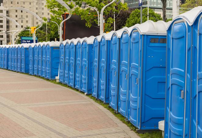 a row of portable restrooms at an outdoor special event, ready for use in Grant-Valkaria